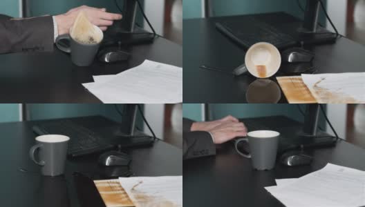 一名男子在工作时把咖啡洒在了桌子上高清在线视频素材下载