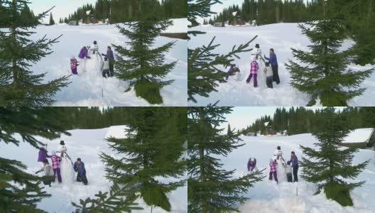 HD鹤:一家人堆雪人高清在线视频素材下载