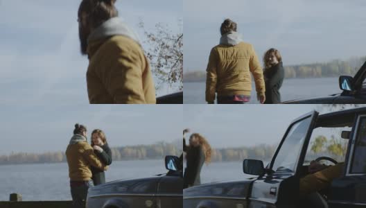 一对年轻夫妇在湖边拥吻高清在线视频素材下载