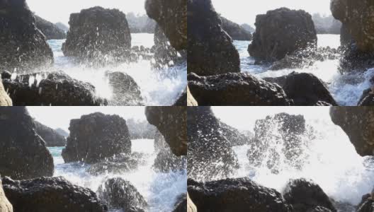 波浪拍打着陡峭的卵石海岸，溅起了水花高清在线视频素材下载