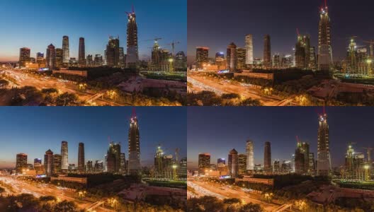 T/L WS HA ZI鸟瞰图北京CBD区域和大型建筑工地与起重机，黄昏到夜晚过渡高清在线视频素材下载