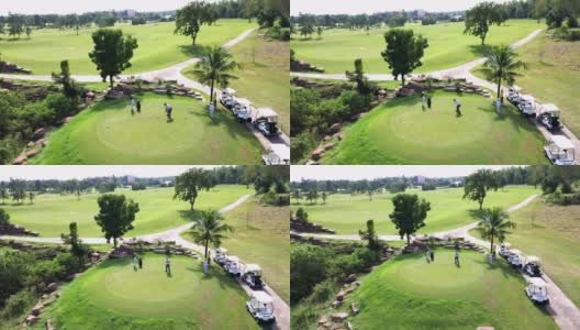 4K鸟瞰一群亚洲人在夏日阳光明媚的高尔夫球场上打高尔夫。高清在线视频素材下载