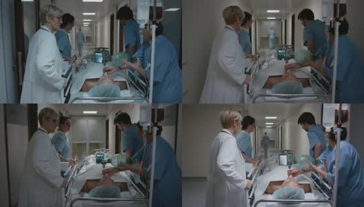 DS医生和她的医疗团队将一个病人放在轮床上转移到手术室高清在线视频素材下载