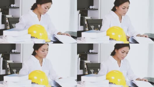 亚洲商业女性使用笔记本，微笑着工作和写作高清在线视频素材下载