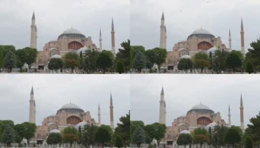 土耳其伊斯坦布尔的圣索菲亚大教堂，海鸥在上面飞翔。世界上各种宗教的历史寺庙。科斯坦蒂诺波尔的历史，成群结队的游客四处游览高清在线视频素材下载