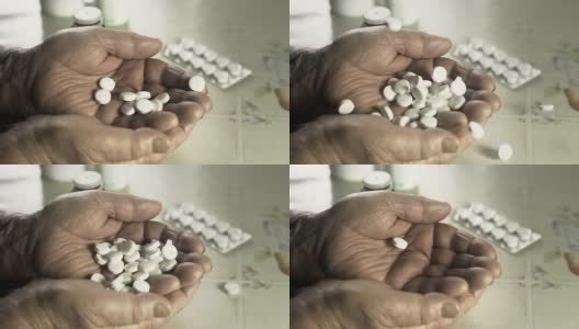 高清慢镜头:药丸落在老妇人手上高清在线视频素材下载
