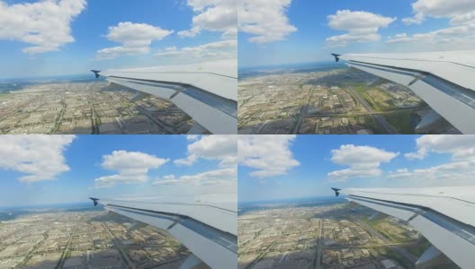 飞机飞过城市时机翼的视频高清在线视频素材下载
