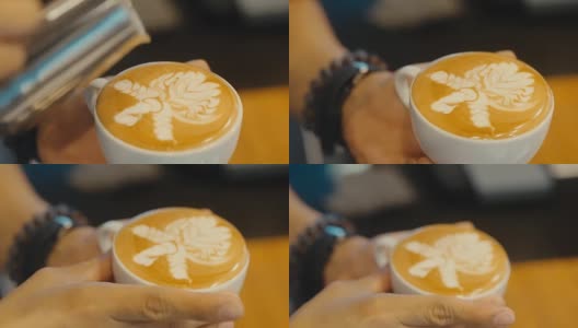 制作拉花艺术，咖啡师倒牛奶。高清在线视频素材下载