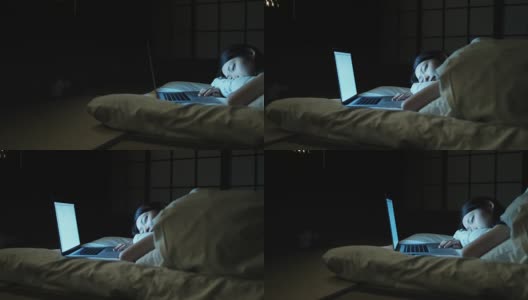 拿着笔记本电脑在床上睡觉的女人高清在线视频素材下载