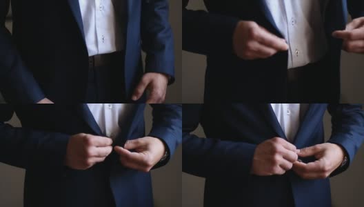 新郎在婚礼前扣上他的蓝色夹克高清在线视频素材下载