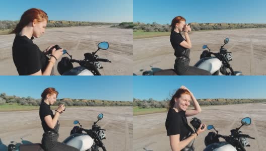 年轻的女摄影师坐在摩托车上，看着日落高清在线视频素材下载