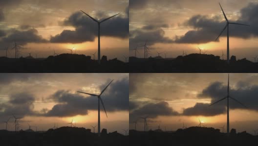 在福建省莆田市沿海的山上，一排晚霞和风力涡轮机在天空中旋转高清在线视频素材下载
