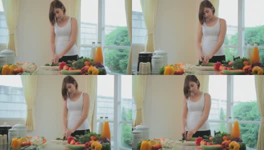 快乐女人烹饪蔬菜绿色沙拉高清在线视频素材下载