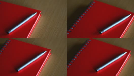 红色笔记本在桌子上高清在线视频素材下载