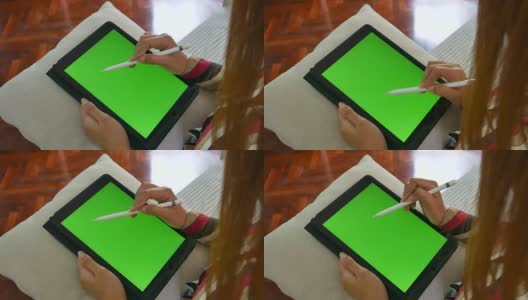 女商人用数字笔在绿色屏幕上写笔记高清在线视频素材下载