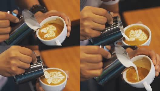 咖啡拿铁艺术，咖啡师倒牛奶。高清在线视频素材下载
