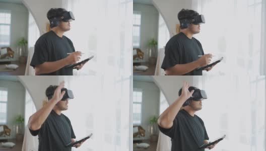 亚洲男子佩戴3D VR眼镜工作，在家享受体验。高清在线视频素材下载