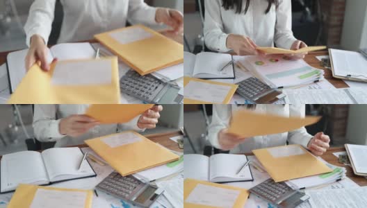 女秘书在办公室的桌子上整理邮件特写4k电影高清在线视频素材下载