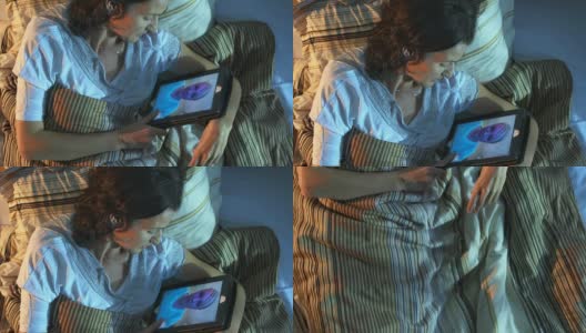 高清起重机:女人在床上视频聊天高清在线视频素材下载