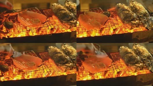 平底锅:切下大鱿鱼，放在海鲜烧烤上高清在线视频素材下载