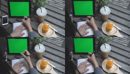 女商人在咖啡店使用平板电脑，绿屏高清在线视频素材下载