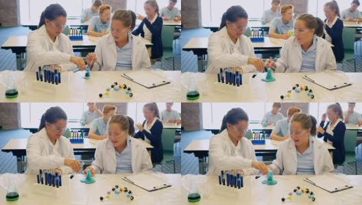 高中女生进行化学实验高清在线视频素材下载