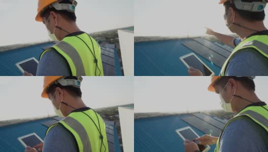 日落时分，一位年轻的亚洲工程师正在用平板电脑检查太阳能光伏板的运行和清洁情况。高清在线视频素材下载
