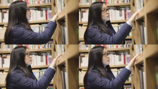 在图书馆里用平板电脑的女人高清在线视频素材下载