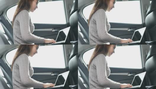 女性在汽车的副驾驶座上使用智能手机高清在线视频素材下载