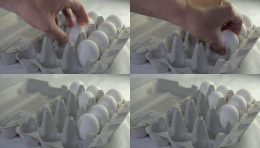 从鸡蛋盘中取出白色的鸡蛋高清在线视频素材下载