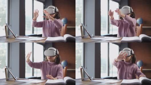 孩子使用虚拟现实耳机参加在线教育课程高清在线视频素材下载