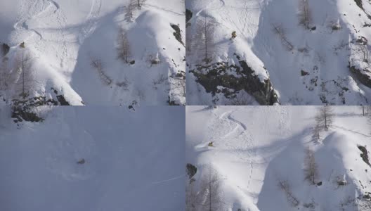 自由式滑雪者从悬崖上跳下，坠入雪崩高清在线视频素材下载