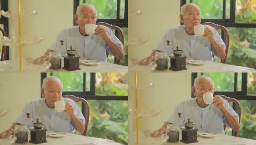 喝着上等咖啡的亚洲老人高清在线视频素材下载