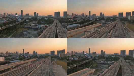 无人机高视角快速铁路高速公路邦苏车站是一个新的铁路枢纽与快速列车日落场景在曼谷，泰国高清在线视频素材下载