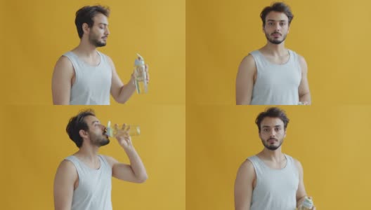 年轻的印度运动员从瓶子里喝水的慢动作肖像，然后看着相机微笑高清在线视频素材下载