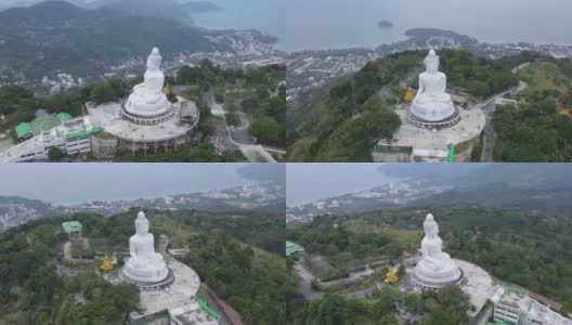 时间推移，以多云的天空在山上环绕白佛像，在地面上看到海岸和海滩区域高清在线视频素材下载