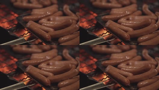 烤架上烤热狗的特写高清在线视频素材下载