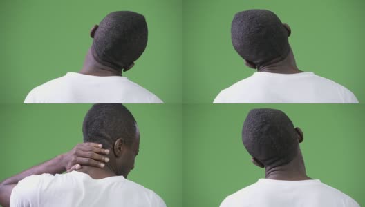 后视图的年轻非洲人颈部疼痛与绿色背景高清在线视频素材下载