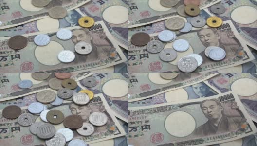 近距离观察日本硬币日元下跌的1000和10000日元纸币背景。超级慢动作120 fsp带声音。高清在线视频素材下载
