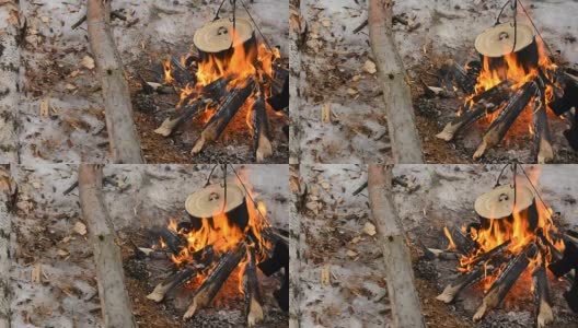冬天，在火上放一个平底锅高清在线视频素材下载