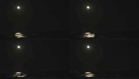 夜晚满月只在海上倒影，假日或旅行背景高清在线视频素材下载