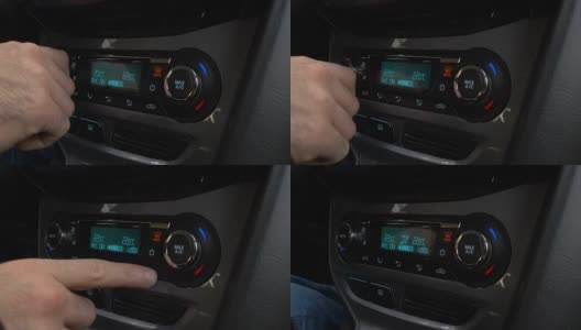 调节汽车空调按钮的手的特写。人使用汽车空调系统高清在线视频素材下载
