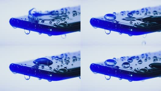 潮湿防水的智能手机覆盖着水滴高清在线视频素材下载