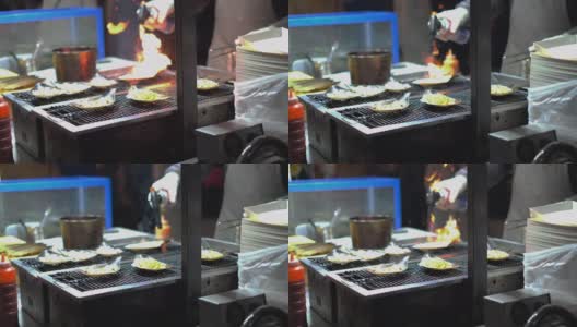 在韩国夜市上燃烧新鲜食物高清在线视频素材下载