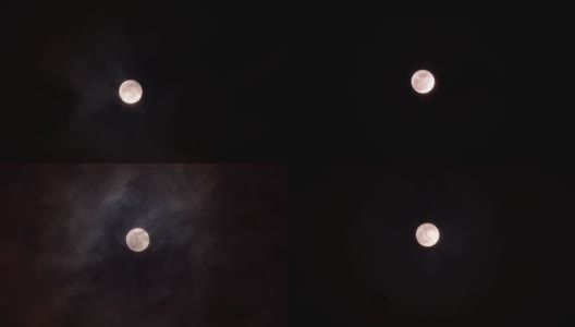 明亮的满月与移动的云背景在晚上的特写，4k镜头，时间流逝，云被月光照亮。高清在线视频素材下载