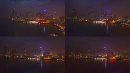 日落天空夜晚照亮了青岛著名的市中心海湾航拍延时全景4k中国高清在线视频素材下载