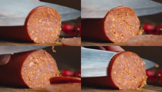 在砧板上把意大利香肠切成小块。高清在线视频素材下载