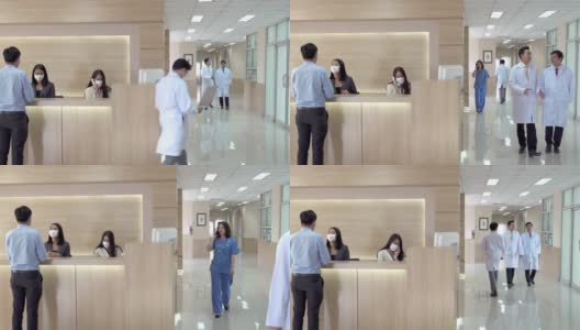 4K宽镜头的大堂等候区在现代化的医院或医疗设施，病人在询问柜台和一组专业医生和护士在医疗中心的卫生服务。高清在线视频素材下载