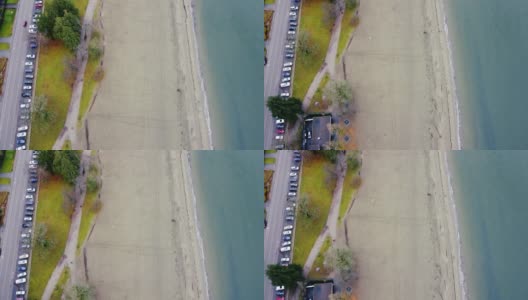 从上往下看海滩和停在加拿大的汽车高清在线视频素材下载