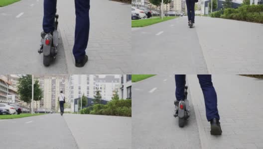 嬉皮士的腿骑着生态滑板车在城市人行道上。商人驾驶电动滑板车在城市人行道上。高清在线视频素材下载